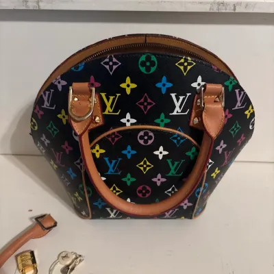 Louis Vuitton Murakami Monogram Multicolore Alma PM handbag in black coated canvas with natural cowhide leather trim, brass hardware,...