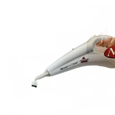 Bissell Steam 'n Clean handheld steam cleaner with a small brush attachment.
