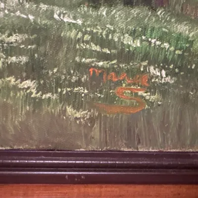 Close-up detail of an artist's signature reading "Marie S" in orange paint on a textured landscape painting.