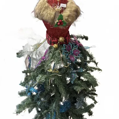 Festive holiday dress form tree decoration, featuring a glittery red torso with faux fur trim, holly accent, and a skirt made of...