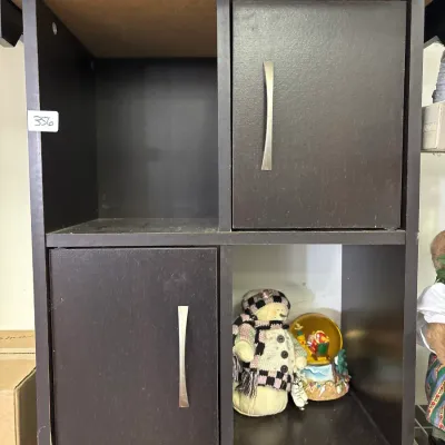Contemporary dark espresso 4-cube storage organizer cabinet featuring two small cabinet doors with silver handles and open shelving.