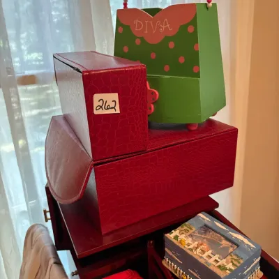 Collection of decorative storage and jewelry boxes, including faux-alligator skin cases, a green polka-dot 'Diva' tote box, and...