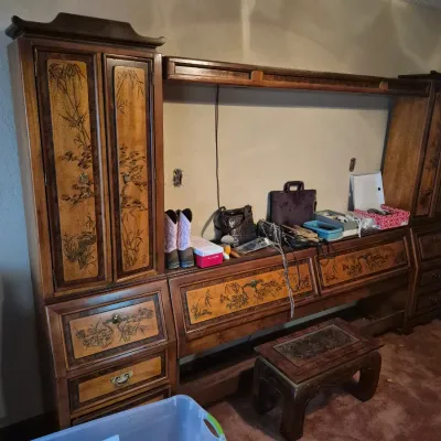 Sale Photo Thumbnail #34: Large Asian-style wooden wall unit with detailed bamboo and floral marquetry, featuring side piers, bridge unit, lower storage drawers, and a matching small low stool.