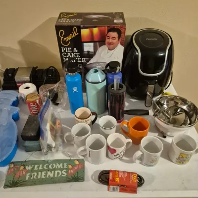 Sale Photo Thumbnail #64: Collection of small kitchen appliances, coffee mugs, and water bottles, including an Emeril pie and cake maker, Power XL air fryer, and Hydro Flasks.