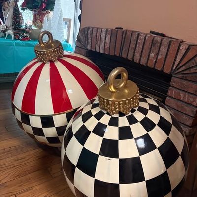 Sale Photo Thumbnail #3: MacKenzie-Childs Jolly Outdoor Ornament pair featuring Courtly Check and red-and-white striped patterns with gold ornament tops.