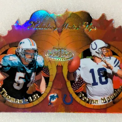 1999 Topps Gold Label Holiday Match-Ups die-cut insert trading card featuring Zach Thomas and Peyton Manning.