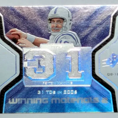 Upper Deck SPx Peyton Manning 'Winning Materials 2' holographic football trading card, featuring his 31 TDs in 2006 milestone.