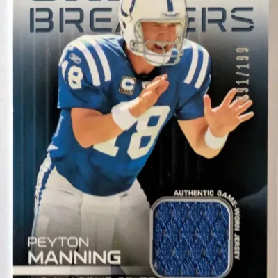 Topps Unique Game Breakers Peyton Manning football trading card featuring an authentic game-worn jersey patch relic, hand-numbered 091/199.