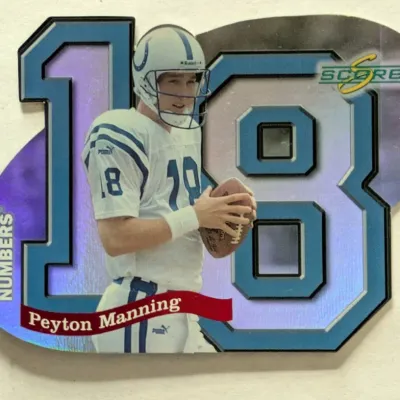 Score 'Behind The Numbers' die-cut football trading card featuring Peyton Manning in his Indianapolis Colts uniform.