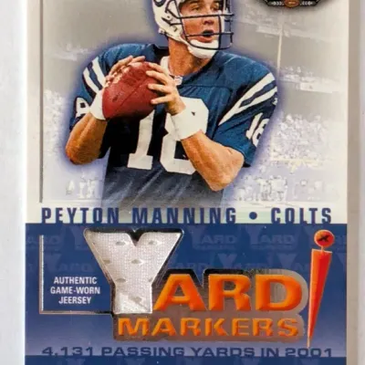 2002 Fleer Box Score Peyton Manning Yard Markers trading card featuring an authentic game-worn jersey swatch.