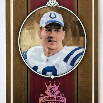 2005 Donruss Gridiron Kings Peyton Manning football card, featured in a circular frame design with a dark gold and maroon border.