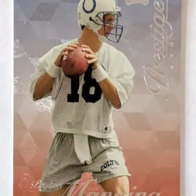 1998 Playoff Prestige Peyton Manning rookie trading card, featuring the Indianapolis Colts quarterback in his practice uniform.
