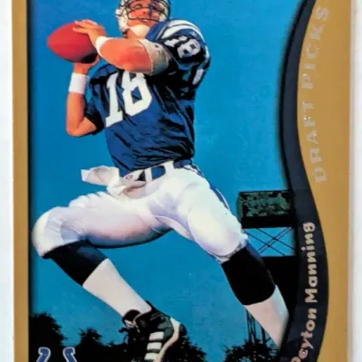 1998 Topps Gold Peyton Manning rookie trading card (#352), featuring the Indianapolis Colts quarterback in his draft picks insert style.