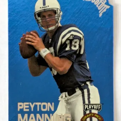 1998 Playoff Absolute Peyton Manning Draft Pick rookie card in a die-cut blue design, featuring the Indianapolis Colts quarterback.