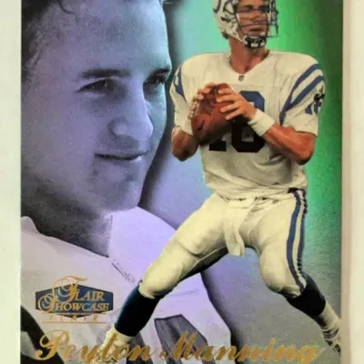Peyton Manning Flair Showcase Indianapolis Colts trading card featuring gold foil lettering and dual-image design.