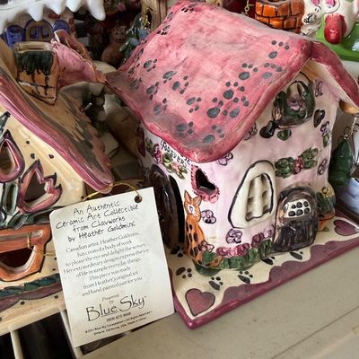  Hand-painted Blue Sky Clayworks ceramic cottage tealight holder designed by Heather Goldminc,featuring a pink paw-printed roof and cat...