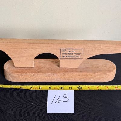 Dritz No. 695 Point Presser and Pounding Block, which is a 2-in-1 wooden Sewing Tool