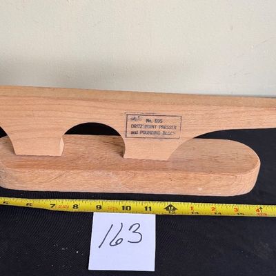 Dritz No. 695 Point Presser and Pounding Block, which is a 2-in-1 wooden Sewing Tool