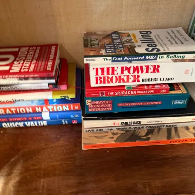 Sale Photo Thumbnail #258: Two stacks of assorted non-fiction and business books, including 'The Power Broker' by Robert Caro and '101 Mission Statements from Top Companies.'
