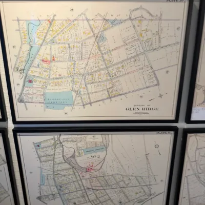 Sale Photo Thumbnail #120: Framed vintage atlas map plates featuring Glen Ridge and Bloomfield, New Jersey, set in modern black frames.