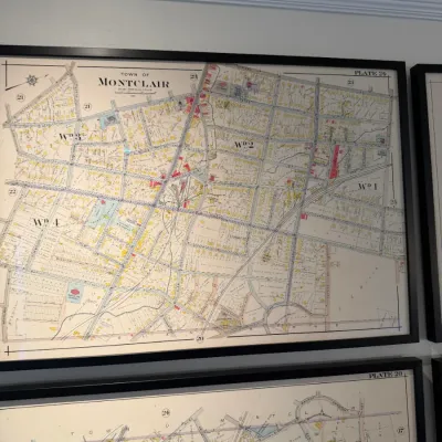 Sale Photo Thumbnail #117: Framed vintage municipal map of the Town of Montclair, featuring Plate 24 with colored street and lot layouts.