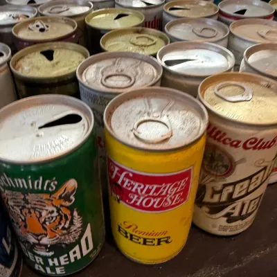 Sale Photo Thumbnail #154: Large collection of vintage pull-tab beer cans, including Schmidt's Tiger Head Ale, Heritage House, and Utica Club Cream Ale.
