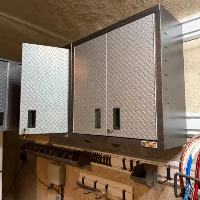 Sale Photo Thumbnail #221: Gladiator wall-mounted steel garage storage cabinets with diamond plate double doors.