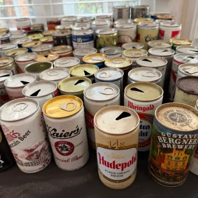 Sale Photo Thumbnail #158: Large collection of vintage pull-tab and flat-top beer cans, featuring brands like Hudepohl, Kaier's, National Bohemian, Rheingold, and Billy Beer.