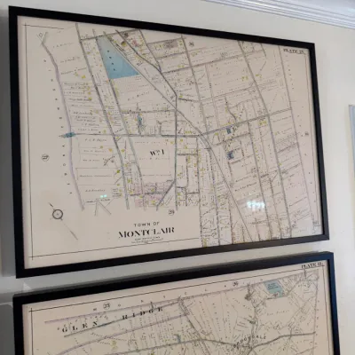 Sale Photo Thumbnail #118: Framed vintage maps of Montclair and Glen Ridge, New Jersey, set in matching simple black frames.