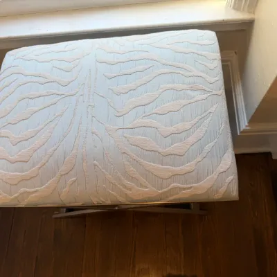 Sale Photo Thumbnail #136: Contemporary X-base ottoman upholstered in light blue textured tiger stripe fabric.