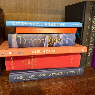 Sale Photo Thumbnail #248: Stack of mixed hardcover books, including titles such as Dragon Rider, Whale Done!, and The Ann Landers Encyclopedia A to Z.