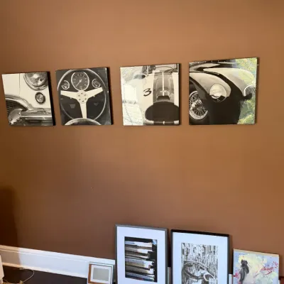 Set of four square canvas wall prints featuring close-up black and white photographs of vintage sports cars.