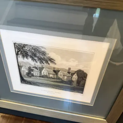 Framed black-and-white landscape engraving titled 'Littlecote Park', set under glass with a dual mat and a silver-tone wooden...