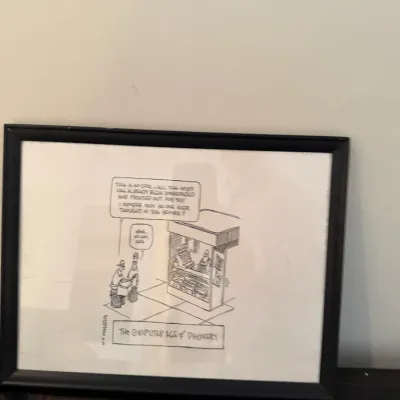 Framed black and white editorial cartoon print titled 'The Computer Age of Discovery' in a simple black frame.