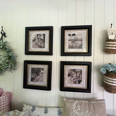 Sale Photo Thumbnail #6: Set of four black-framed Sepia tone architectural prints, displayed alongside woven wall baskets and a faux eucalyptus wreath.