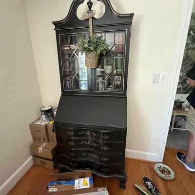 Sale Photo Thumbnail #3: Black-painted traditional slant-front secretary desk hutch top, glass doors, and gold filigree accents.