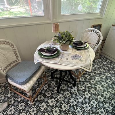 Sale Photo Thumbnail #5: Three-piece bistro dining set featuring two white woven peacock-style chairs and a small round table with dark pedestal base.