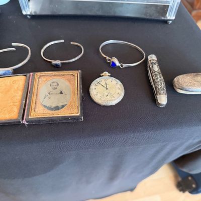 Assortment of vintage items including three sterling silver cuff bracelets, a framed cased tintype portrait of a child, an ornate...