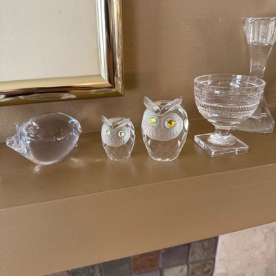 Collection of clear crystal glass figurines and glassware, including a pig figurine, two faceted Swarovski-style owls with crystal eyes,...