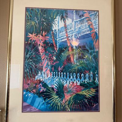 Framed tropical landscape print signed by Ken Frank, double-matted in a thin gold metal frame.
