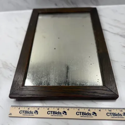 Antique oak wood-framed wall mirror