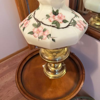 Sale Photo Thumbnail #84: Vintage Rayo electric table lamp featuring a hand-painted floral milk glass shade and a polished brass base.