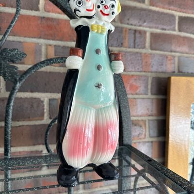 Sale Photo Thumbnail #5: Vintage ceramic two-headed clown decanter, hand-painted with a tuxedo jacket, striped pants, and bowtie details.