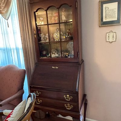 Sale Photo Thumbnail #13: Traditional dark wood secretary desk with an upper glass-front display cabinet, drop-front writing surface, and brass hardware.