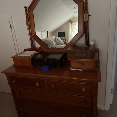 Sale Photo Thumbnail #35: Vintage Colonial Revival wooden chest of drawers featuring an attached octagonal mirror and small tabletop storage drawers.