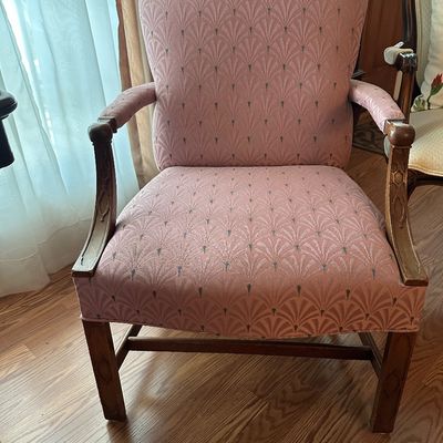 Sale Photo Thumbnail #61: Vintage arm chair featuring carved wooden frame accents and dusty pink fan-patterned upholstery.