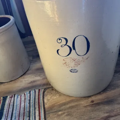 Sale Photo Thumbnail #51: Large vintage Red Wing 30-gallon stoneware crock featuring the red wing emblem and blue oval maker's stamp.