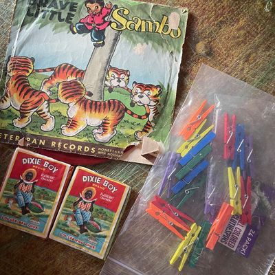 Sale Photo Thumbnail #187: Vintage collection including a Peter Pan Records "Brave Little Sambo" vinyl sleeve, two Dixie Boy Brand firecracker boxes, and a bag of mini colored wooden clothespins.