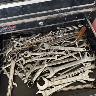 Sale Photo Thumbnail #78: Large collection of assorted hand tools, including Craftsman and Oxwall wrenches, filling a tool chest drawer.