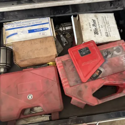 Sale Photo Thumbnail #75: Toolbox drawer filled with specialty automotive hand and pneumatic tools, including Blue-Point die grinders, screw extractors, and red hard-shell storage cases.